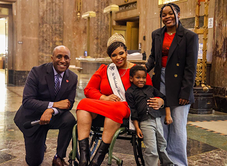 Tara with family and Mayor Quinton Lucas