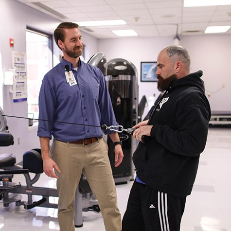 Physical therapist with patient