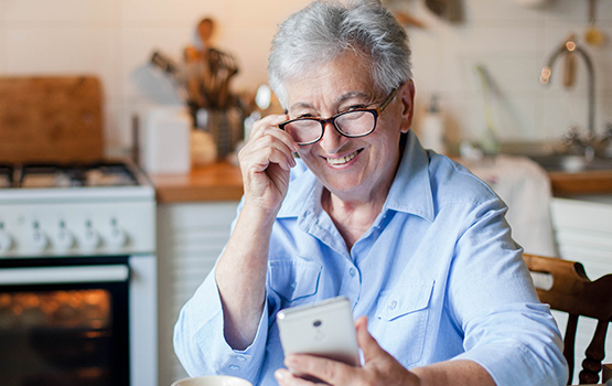 older woman looking at phone