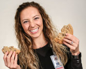 Sidney Juergens holding a Chocolate Chip Cookie