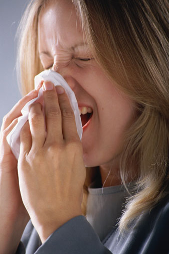 Woman sneezing