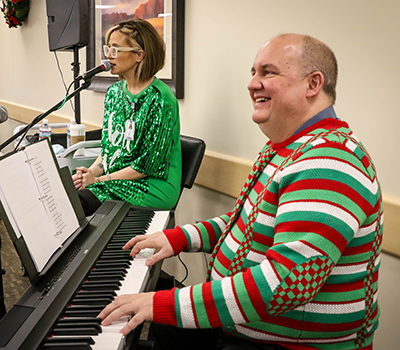 Carl playing piano during holiday dinner