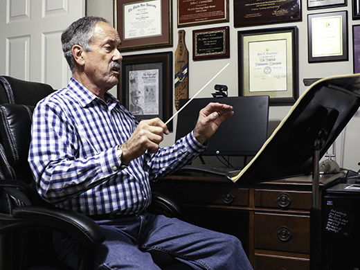 John conducting at home