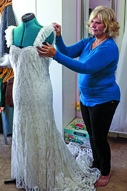 Debbie working on wedding dress