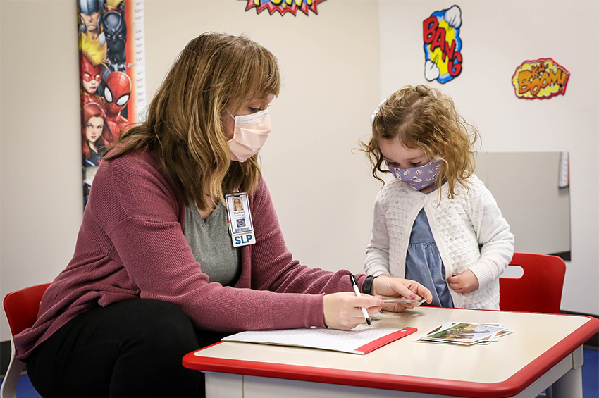 Stephanie Ramirez, MA, CCC-SLP, CDCS, uses a variety of speech-therapy techniques, including flash cards, to engage children.