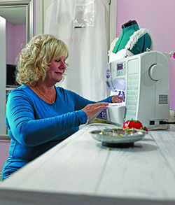 Debbie with sewing machine