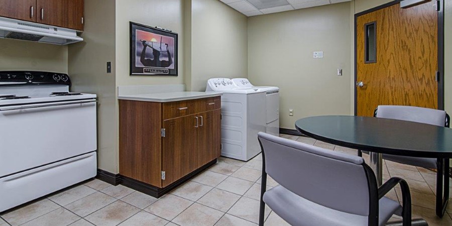 Photo of the kitchen and washer/dryer on the Acute Rehab Unit at North Kansas City Hospital